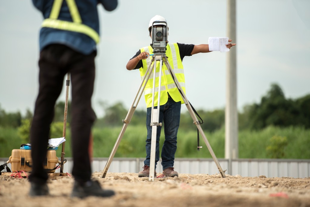 Worker surveying the land