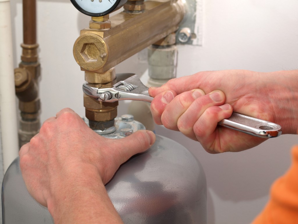 Man fixing the boiler