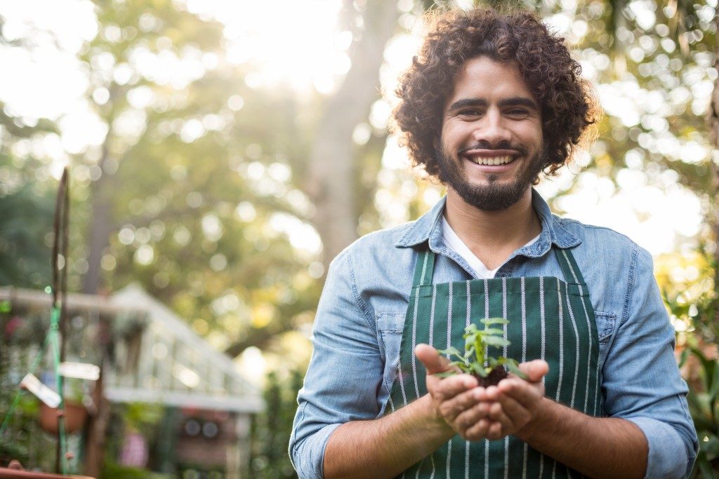 man taking care of plants