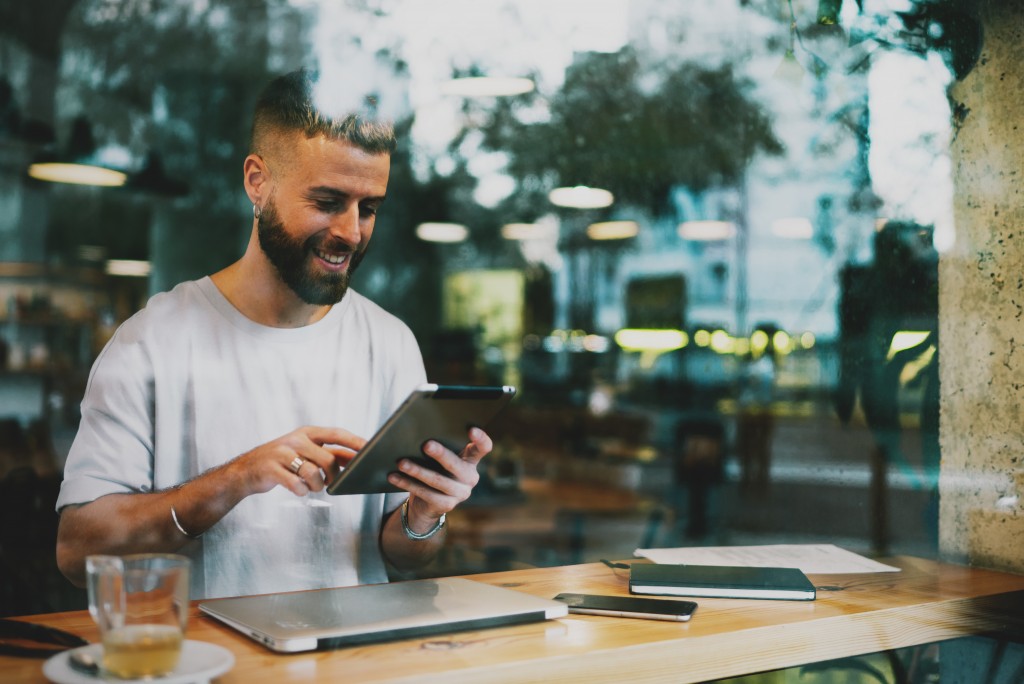 man at the cafe smiling