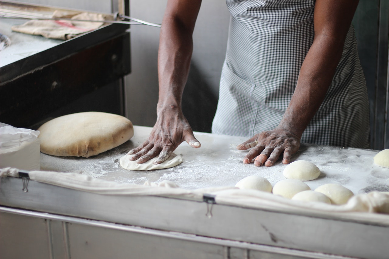 man preparing dough