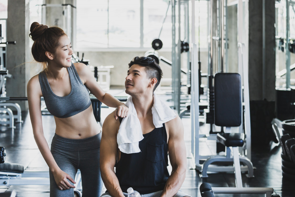 man and woman in a gym