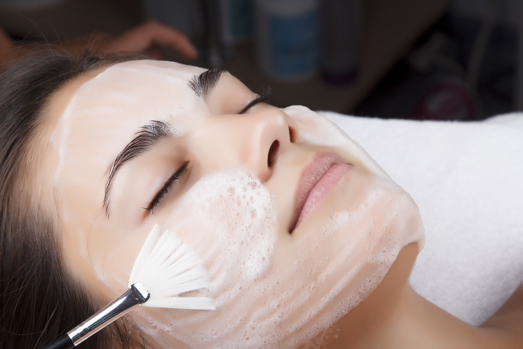 woman receiving facial treatment