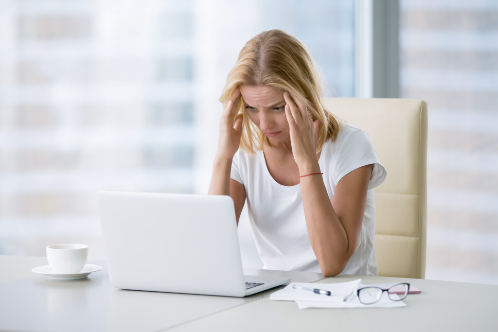 a stressed person in front of a computer