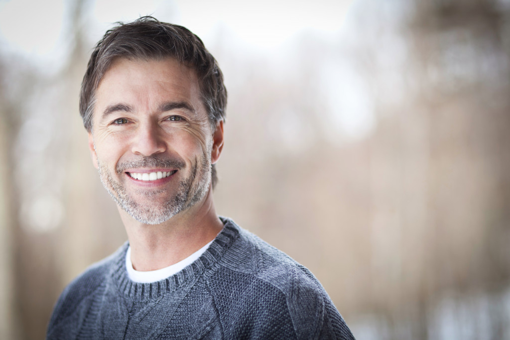 man with beard wearing a denim sweatshirt