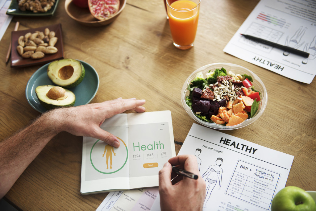 man eating a healthy hearty meal and planning for the day.