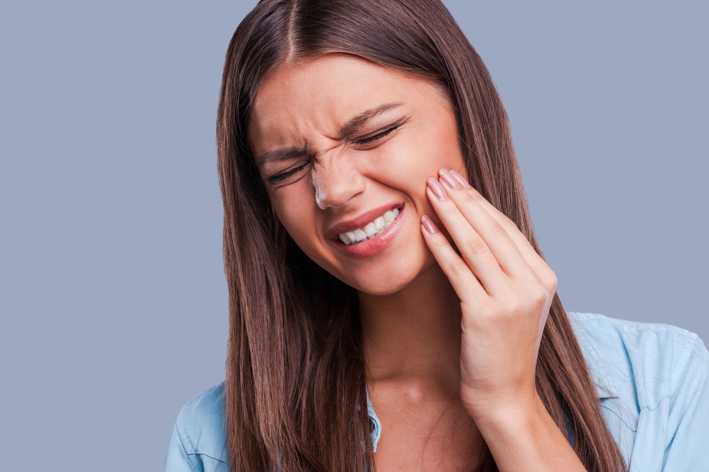 A person experiencing severe mouth pain