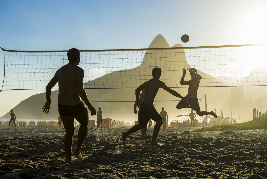 people doing beach volleyball