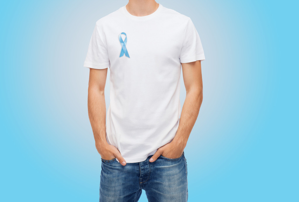 A man wearing blue ribbon for prostate cancer awareness