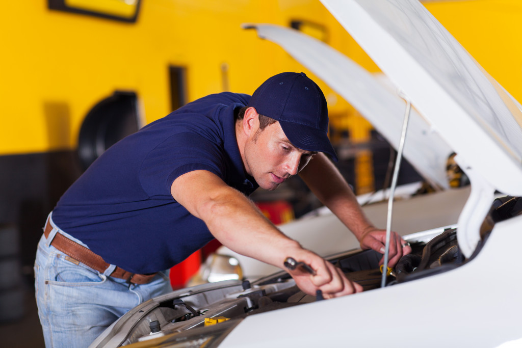 auto mechanic repairing a car