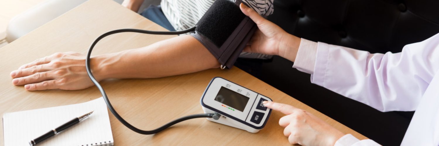a person testing their blood pressure