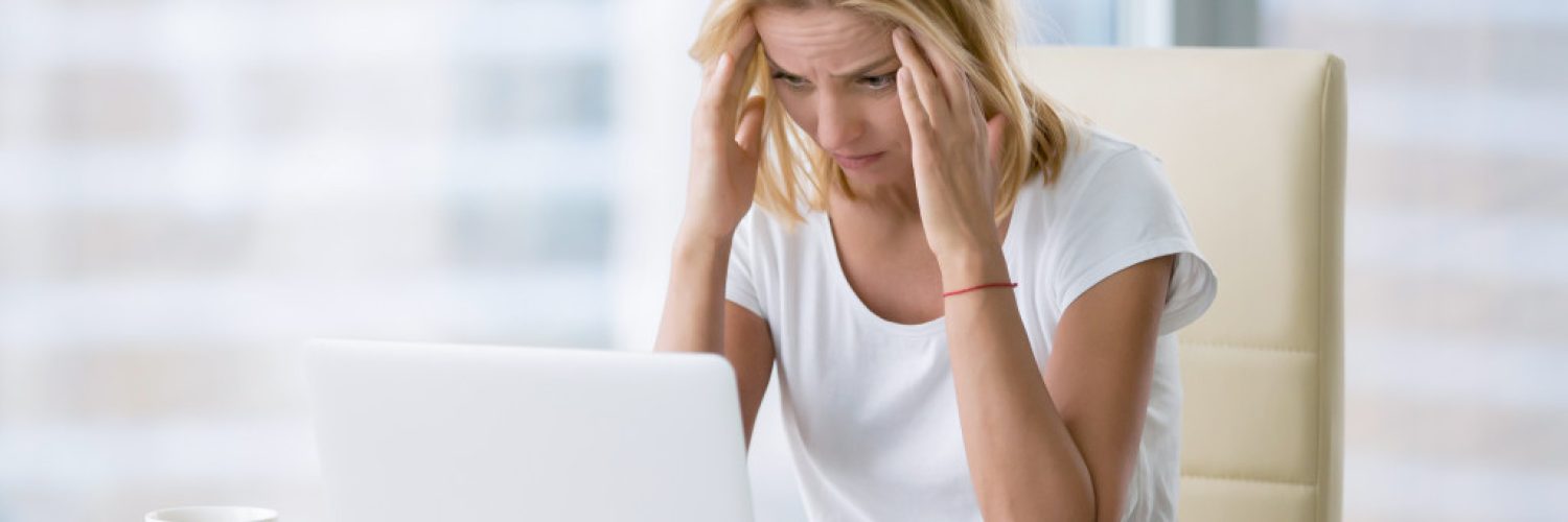 a stressed person in front of a computer