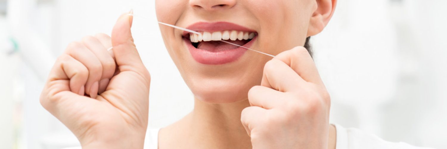 a woman flossing